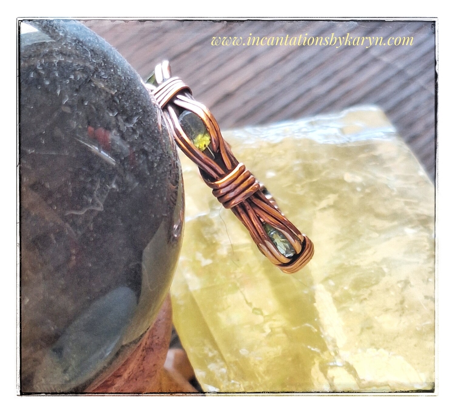 Peridot and copper channel set ring