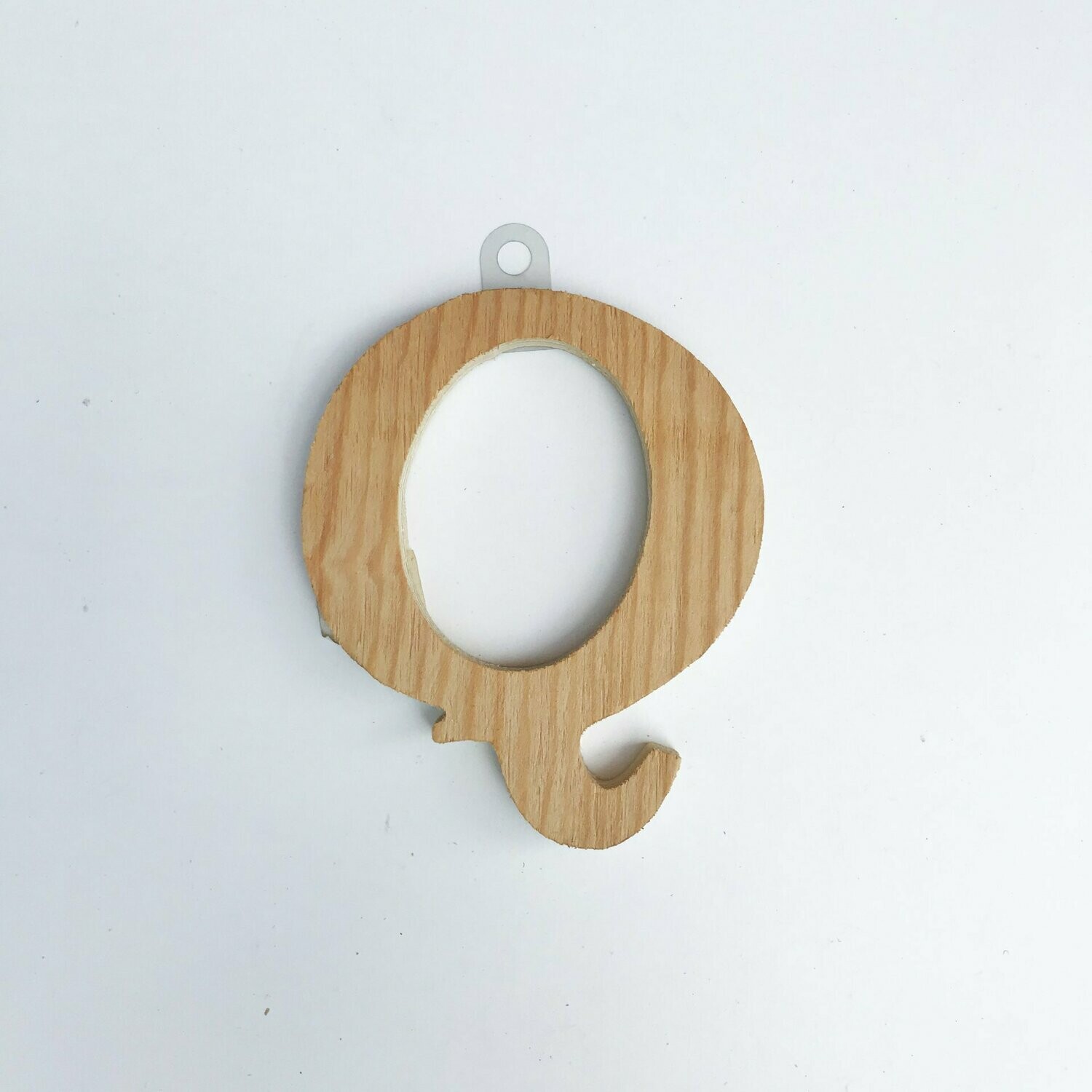 Q de madera