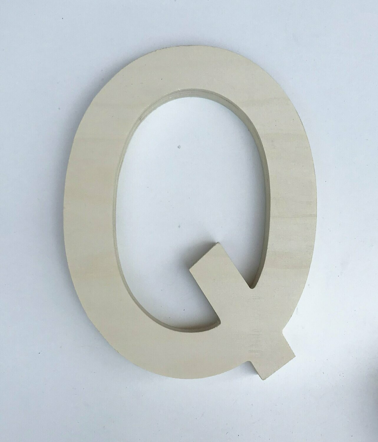 Q de madera