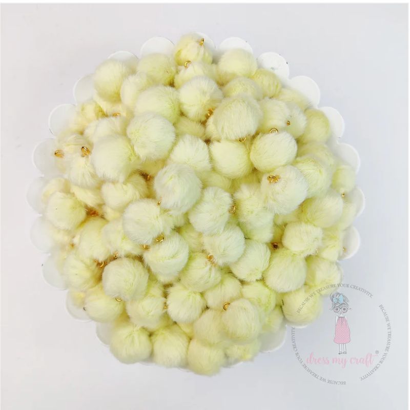 POMPONES PASTEL CON LAZO AMARILLO CLARO