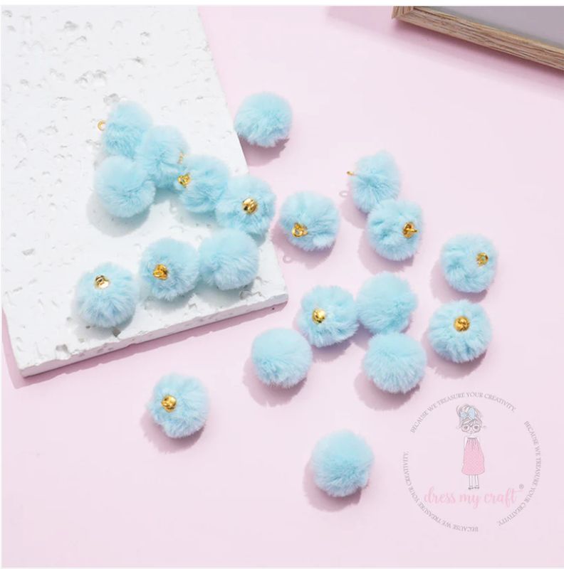 POMPONES EN TONOS PASTEL CON LAZO- AZUL BEBÉ