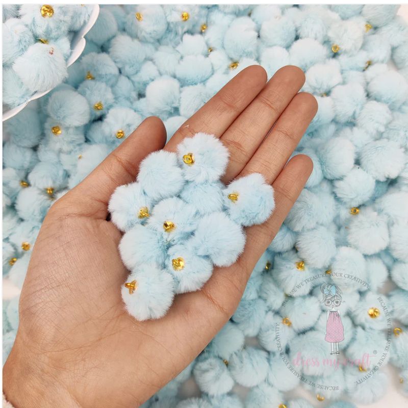 POMPONES EN TONOS PASTEL CON LAZO- AZUL BEBÉ