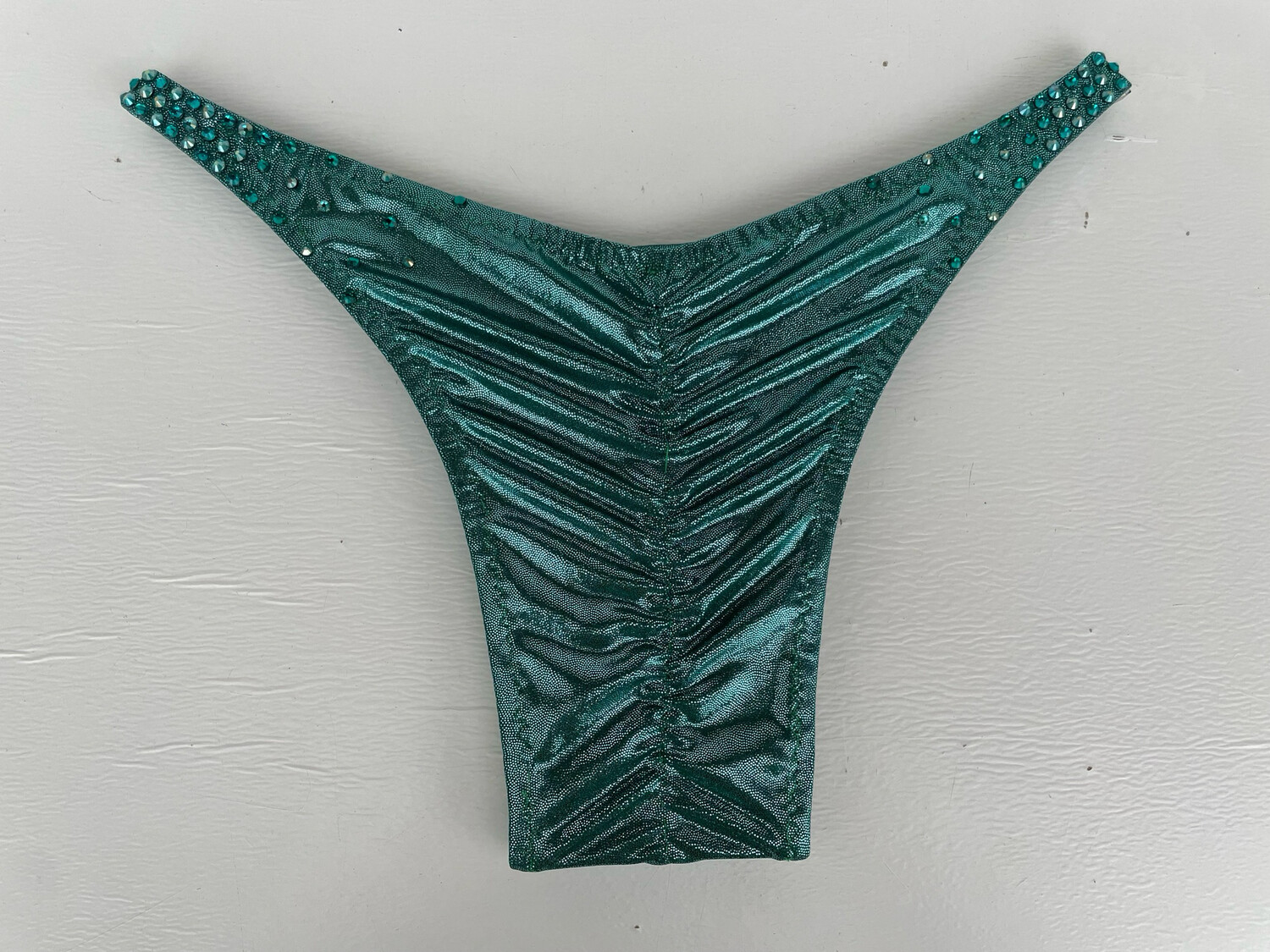 Green metallic Trunks with stones