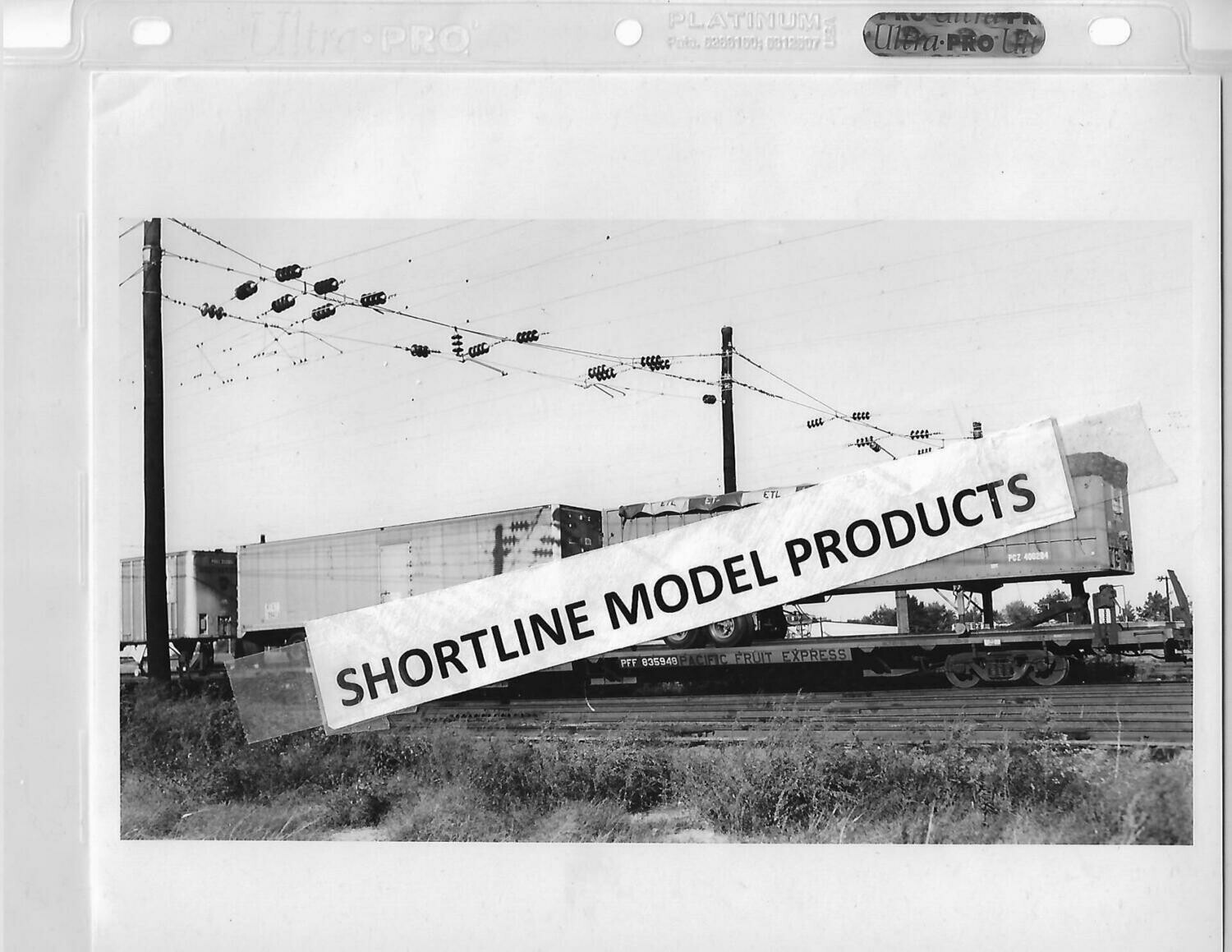 Penn Central (PC) Open top trailer on PFE 835948 Flat 1968