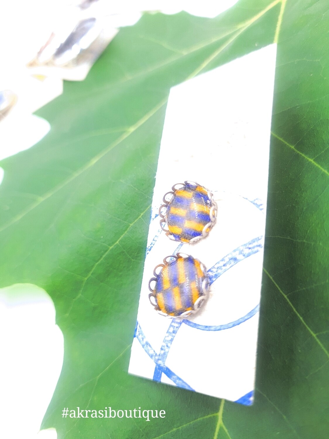 Round blue and yellow ankara silver stud earrings sealed in resin
