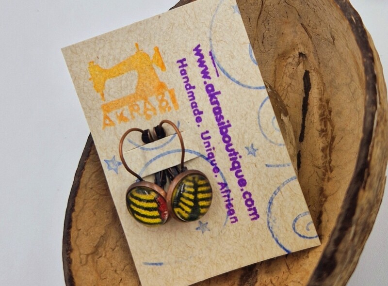 Red and yellow ankara on round copper drop earrings