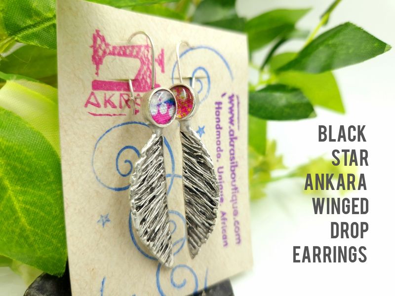 Antique silver black star ankara winged drop earrings