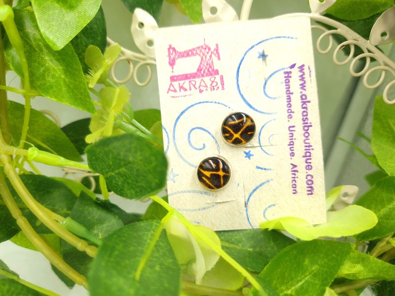 Round deconstructed Calabash Collection silver stud earrings sealed in glass
