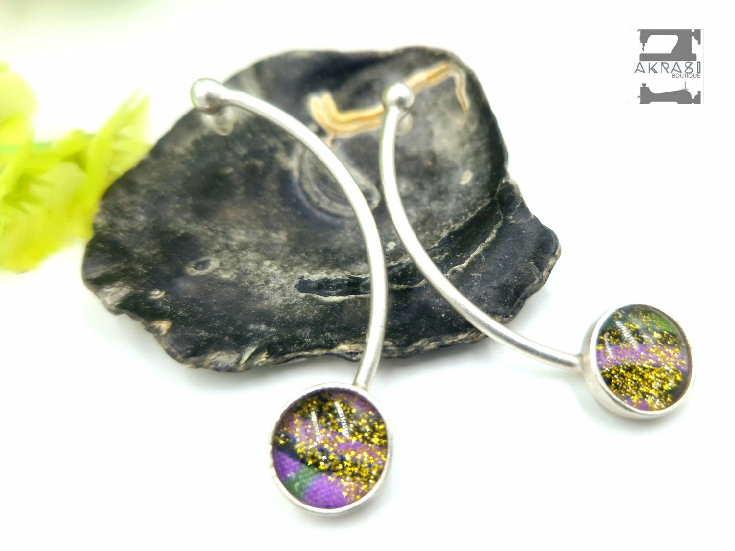 Curved silver stud earrings sealed in glass