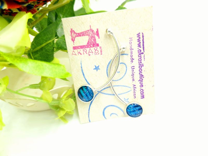 Curved silver stud earrings sealed in glass