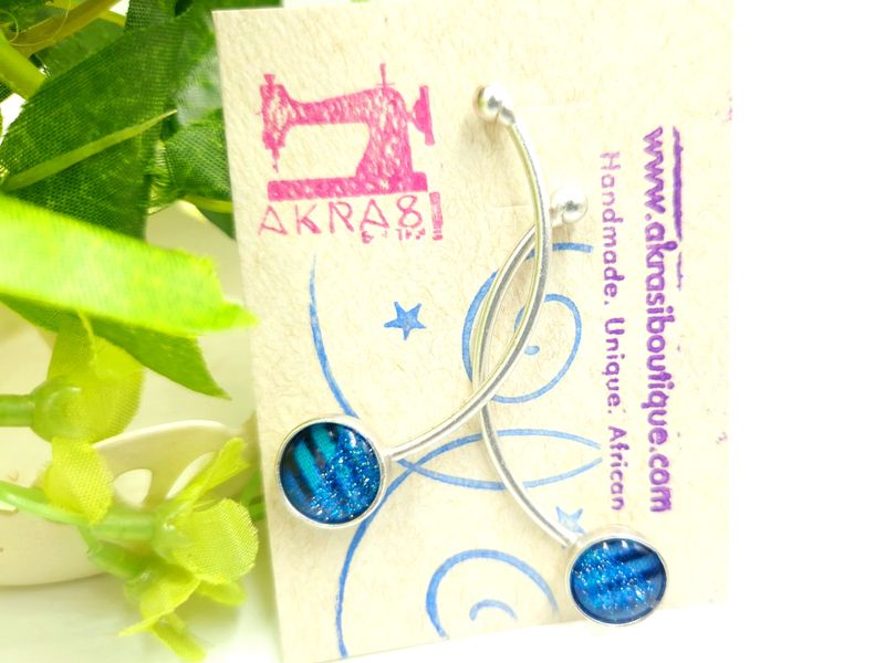 Curved silver stud earrings sealed in glass