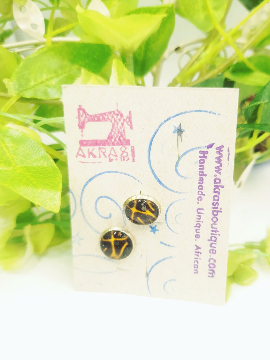 Round deconstructed kente in white and blue on silver stud earrings sealed in glass Round deconstructed kente in white and blue on silver stud earrings sealed in glass