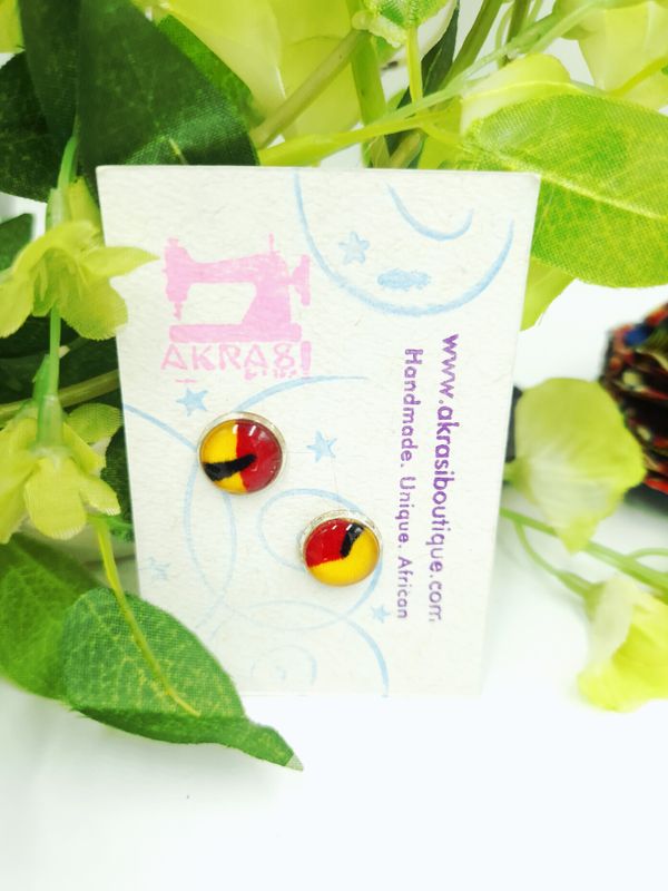 Round kente in yellow, red and black on silver stud earrings sealed in glass