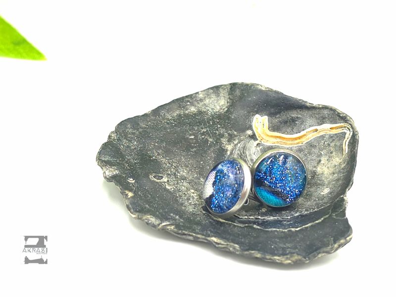 Round blue and glitter on silver stud earrings sealed in glass