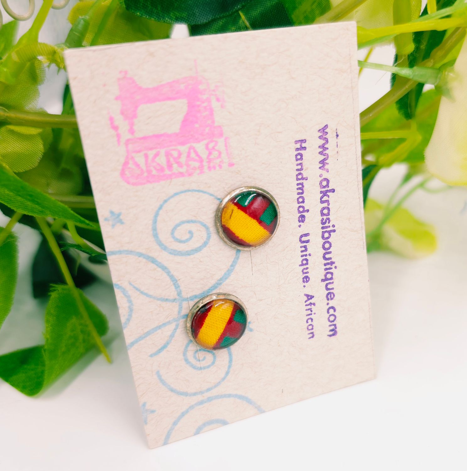 Round kente in yellow, red and green on silver stud earrings sealed in glass