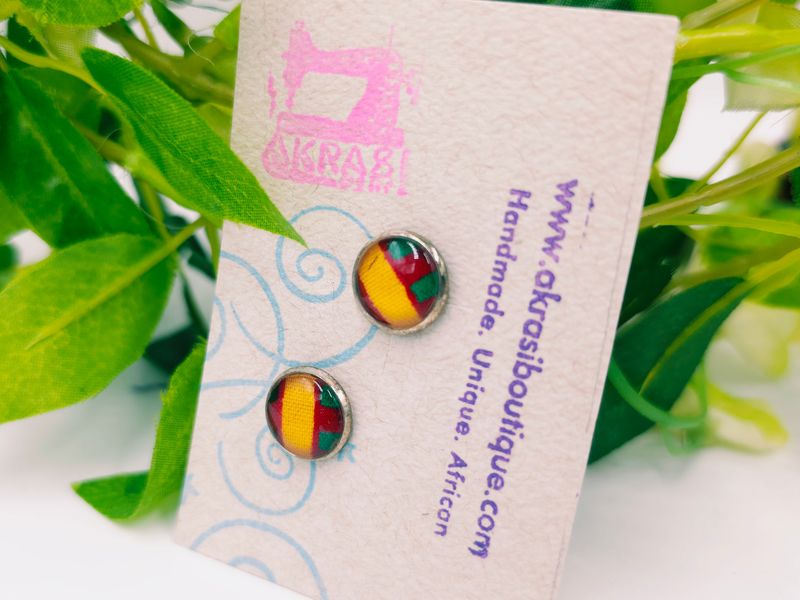 Round kente in yellow, red and green on silver stud earrings sealed in glass