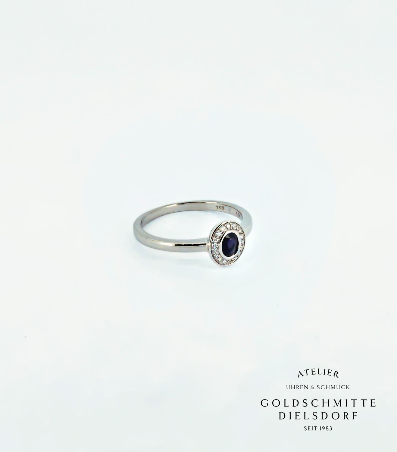 Damenring Weissgold 750 mit Saphir und Brillant Entourage