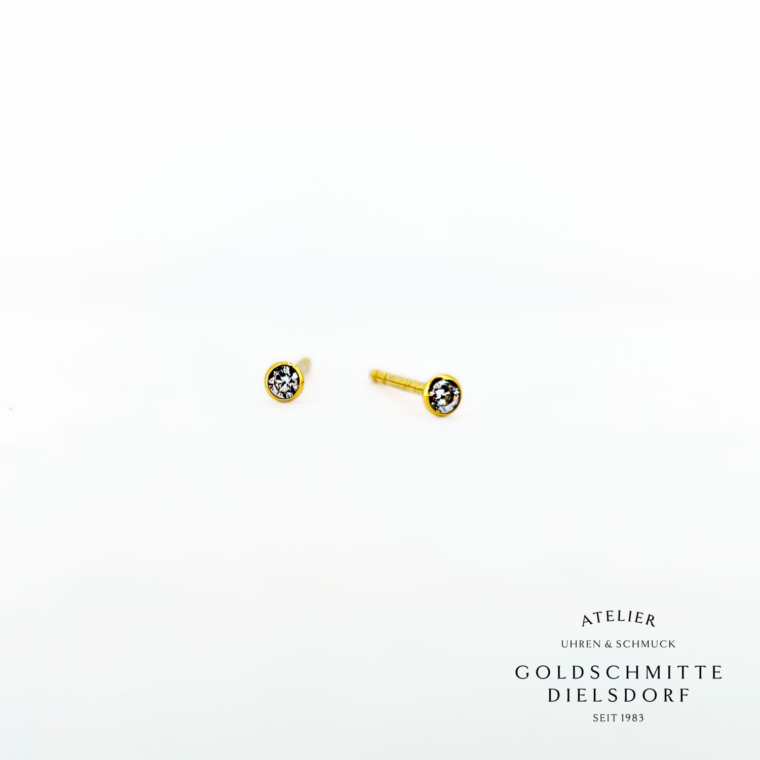 Solitär - Ohrstecker mit 2 Zirkonia Gelbgold 750 Solitär - Ohrstecker mit 2 Zirkonia Gelbgold 750