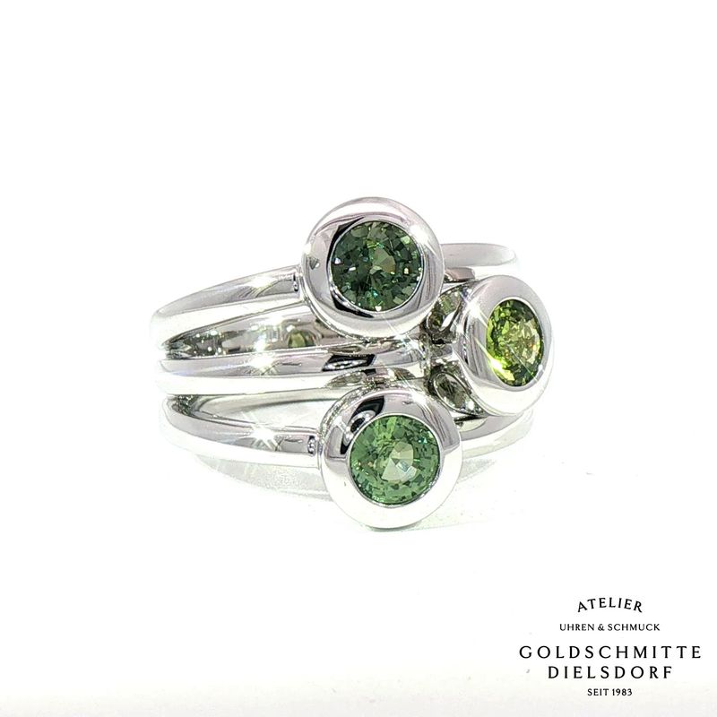 Damenring Pop Up mit grünen Saphiren in Weissgold 750 Damenring Pop Up mit grünen Saphiren in Weissgold 750