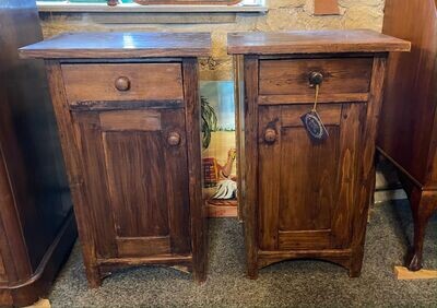 A pair of matched pitch pine bedside cabinets