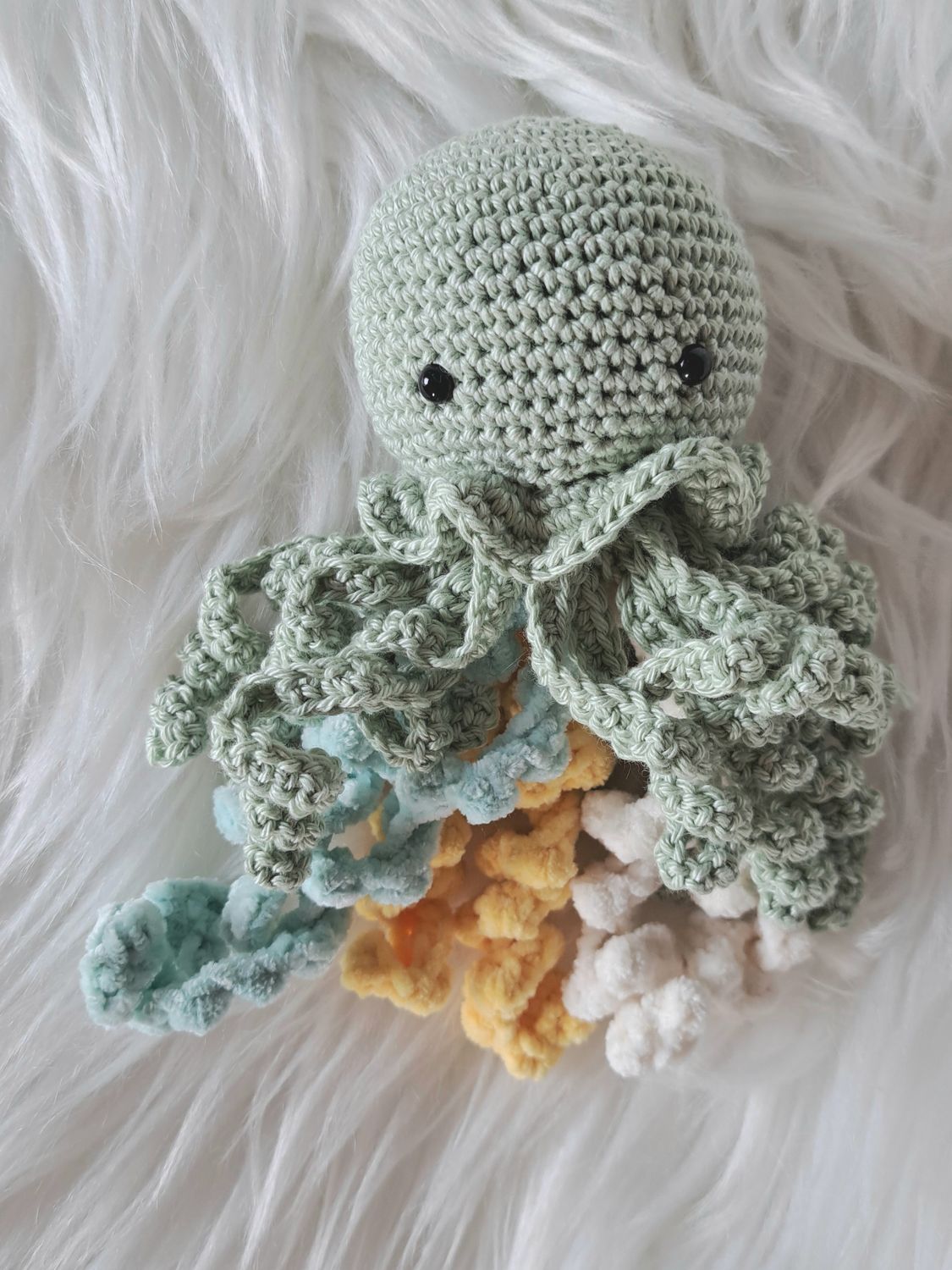 Doudou Méduse grelot vert avec tentacules