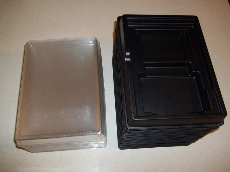 Empty plastic TI-99/4a cart box with clear top