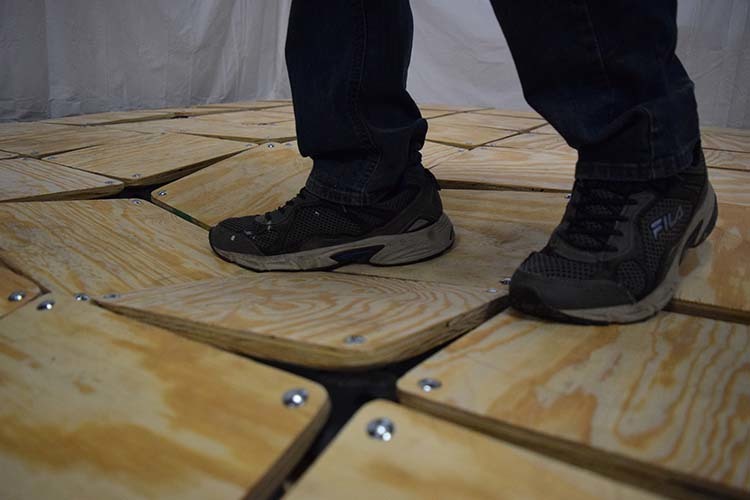 Someone stepping on a squishy floor designed for theme park and amusement attractions. 