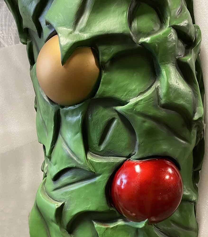 Close-up of a Christmas wreath theme park prop for photo opportunities. 