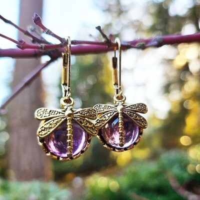 Opalite dragonfly earrings in Clear, Purple, and Blue Lagoon hues symbolizing transformation and light.