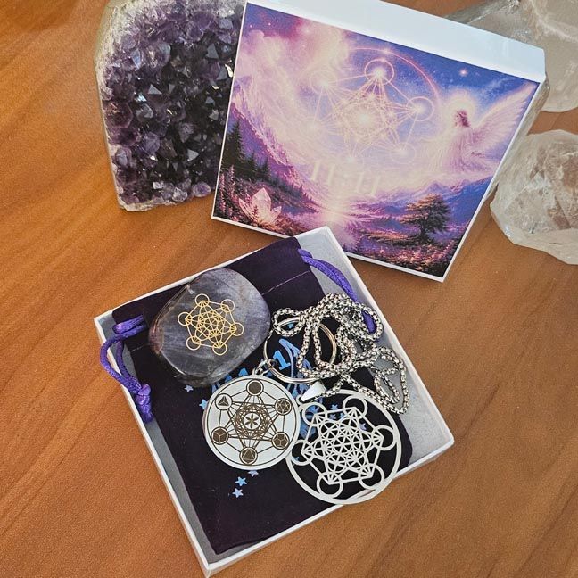 Metatron’s Cube pendant, palm stone, and keychain arranged in a gift box as a spiritual harmony set.