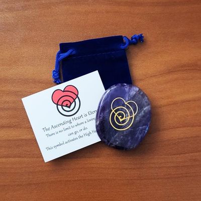 Amethyst Ascension Stone engraved with the Ascending Heart symbol for High Heart activation and higher love.