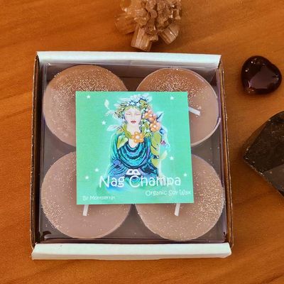Nag Champa soy brown tea lights with sandalwood, frangipani, and Buddha of the Garden artwork.