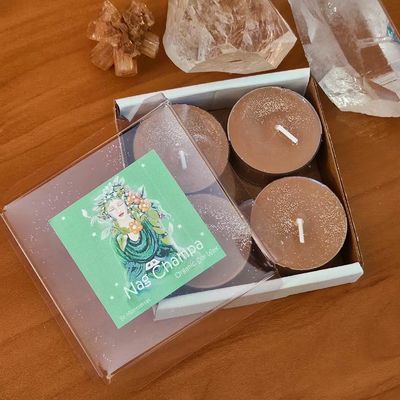 Nag Champa soy brown tea lights with sandalwood, frangipani, and Buddha of the Garden artwork.