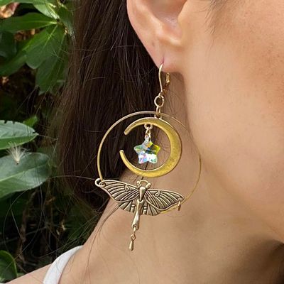 Luna Moth earrings with brass wings, crescent moons, and iridescent angel aura star crystals.