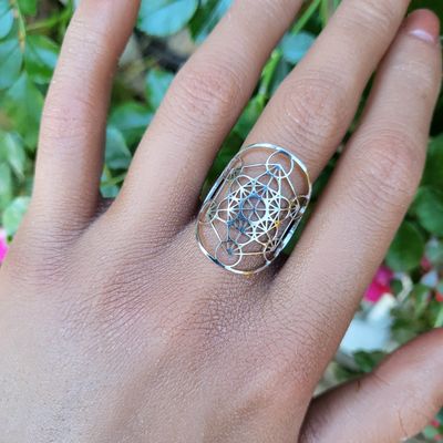 Adjustable stainless steel ring engraved with Metatron’s Cube sacred geometry symbol.