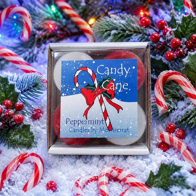 Candy Cane soy tea lights in red and white, peppermint scented, surrounded by festive holiday decor.