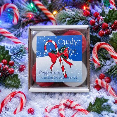 Candy Cane soy tea lights in red and white, peppermint scented, surrounded by festive holiday decor.