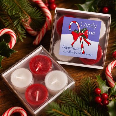 Candy Cane soy tea lights in red and white, peppermint scented, surrounded by festive holiday decor.