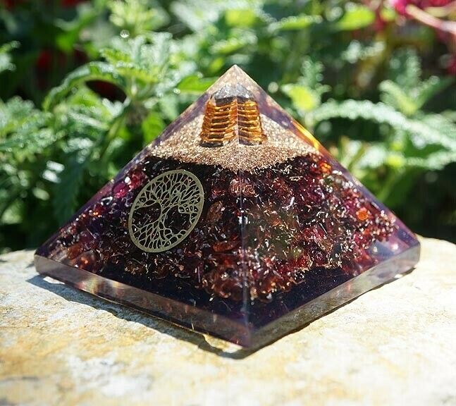 Garnet orgone pyramid with Tree of Life, clear quartz point, and copper spiral, 3-inch base.