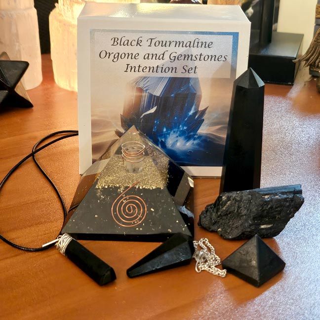 Black Tourmaline orgone set with pyramid, pendant, pendulum, and rough stone for grounding and protection.