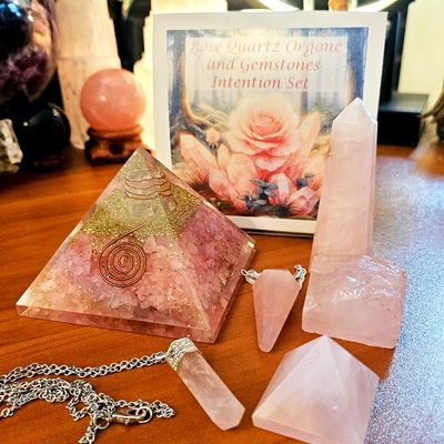 Rose Quartz orgone set with pyramid, pendant, pendulum, and rough stone for love and emotional healing.