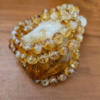 Natural Citrine bracelet with untreated 8mm golden beads offering joy, abundance, and uplifting solar energy.