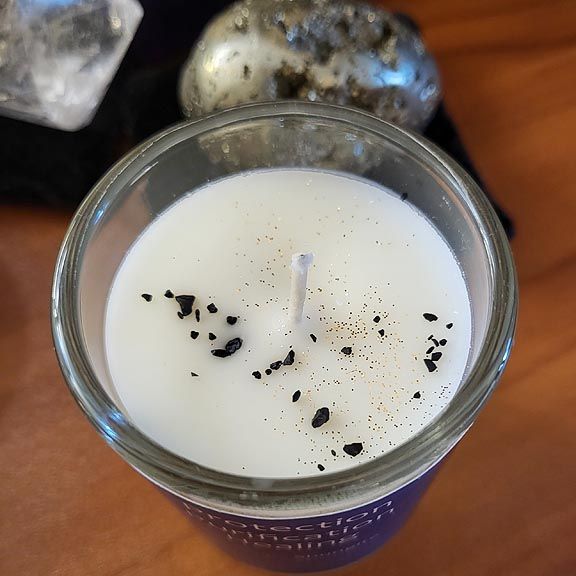 Shungite organic soy candle with Mint, Orange, Lavender, and Shungite stones for grounding and protection.