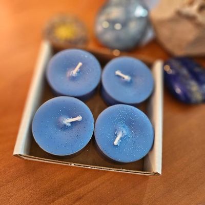 Ganesh blue soy tea lights with basil essential oil in a box of four.