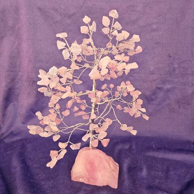 Rose quartz gemstone tree with matching raw stone base