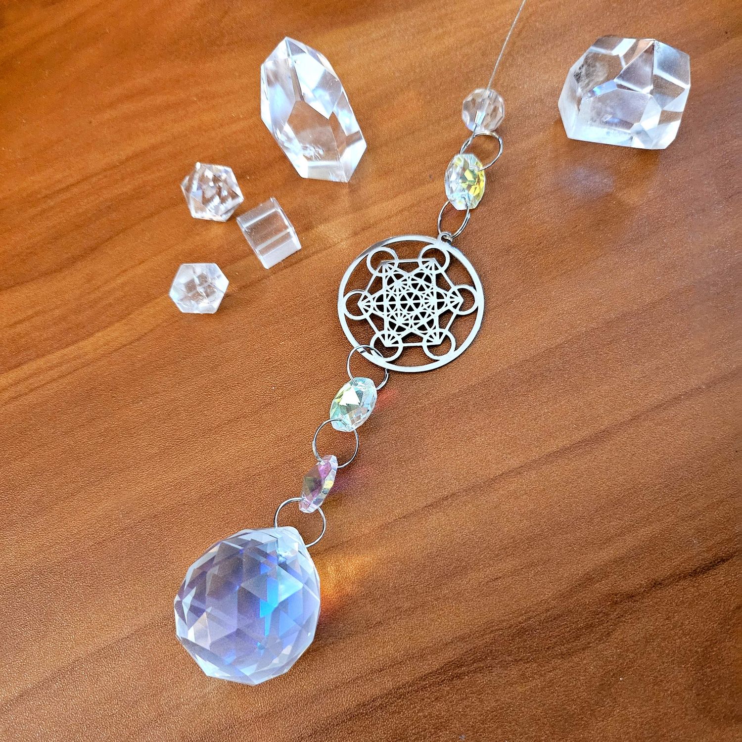 Metatron’s Cube suncatcher with crystal prisms for protection, clarity, and sacred geometry light.
