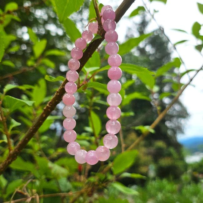 Pink Kunzite bracelet with natural 6mm beads offering heart healing, emotional clarity, and gentle feminine energy.
