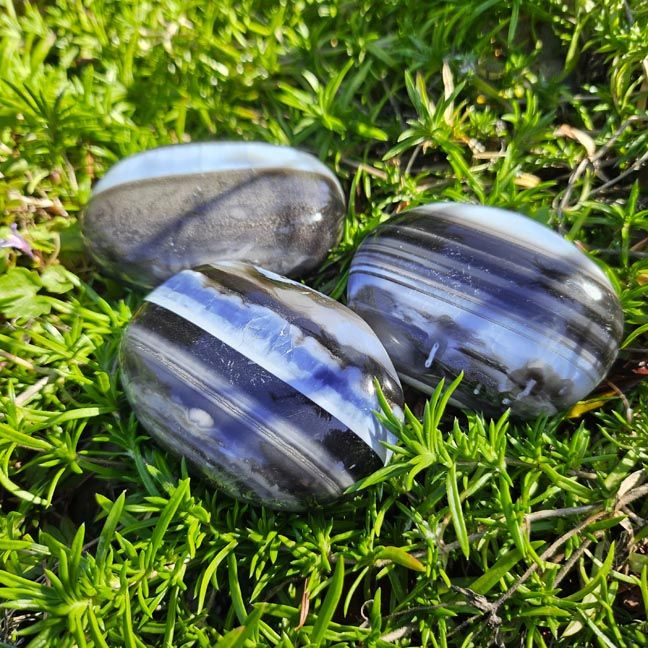 Natural Blue Opal 2" palm stone with soft blue hues for peace, emotional clarity, and gentle communication.