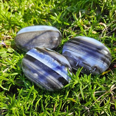 Natural Blue Opal 2" palm stone with soft blue hues for peace, emotional clarity, and gentle communication.