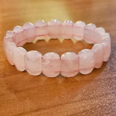 Rose quartz bracelet with flat faceted pink slabs, offering soothing heart‑centered energy and emotional healing.